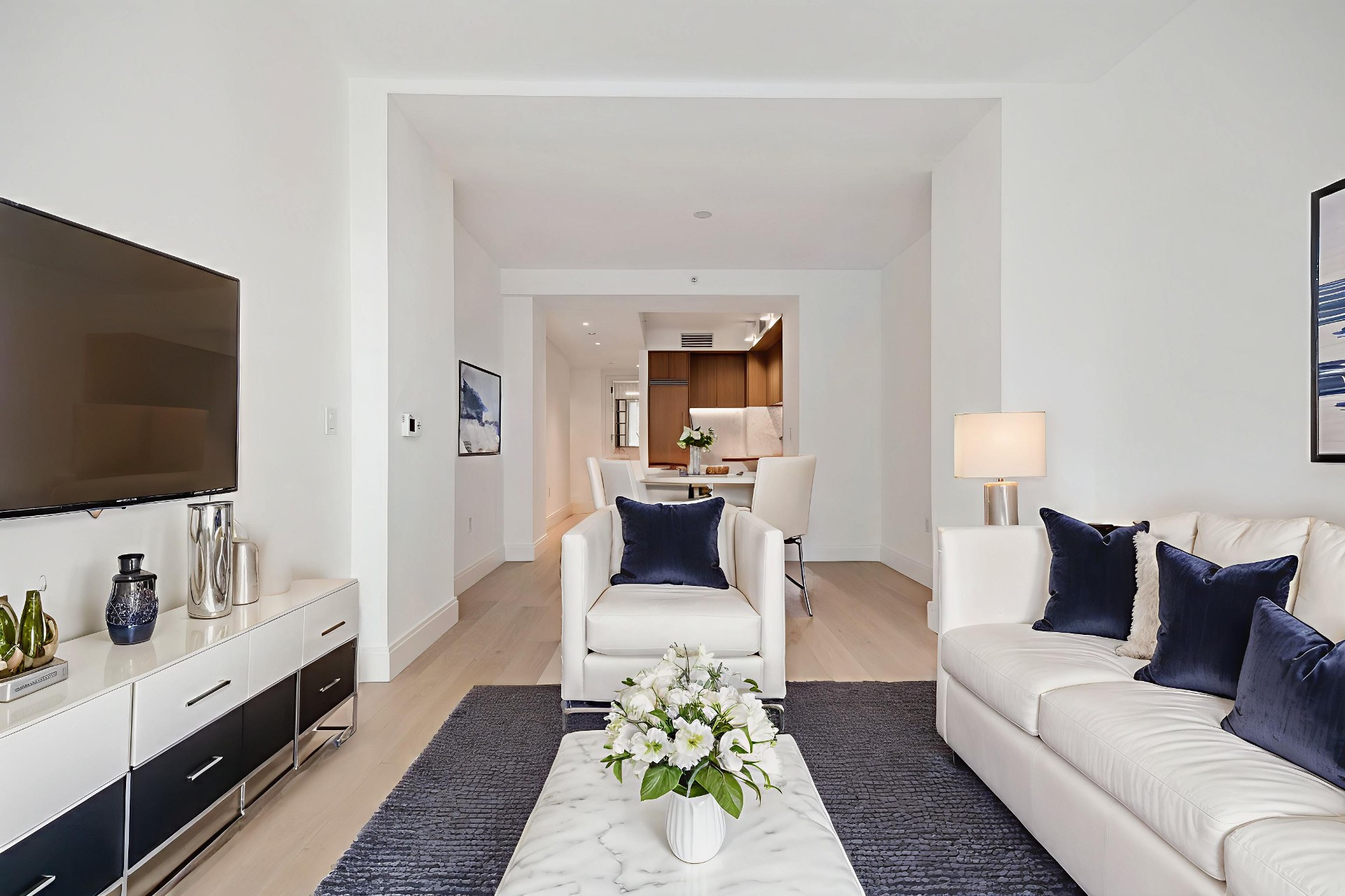 Open living area with floor-to-ceiling windows and 7-inch white oak plank flooring